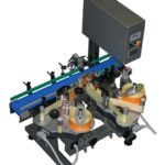 Sistema di etichettatura per applicazione fronte e retro su contenitori cilindrici